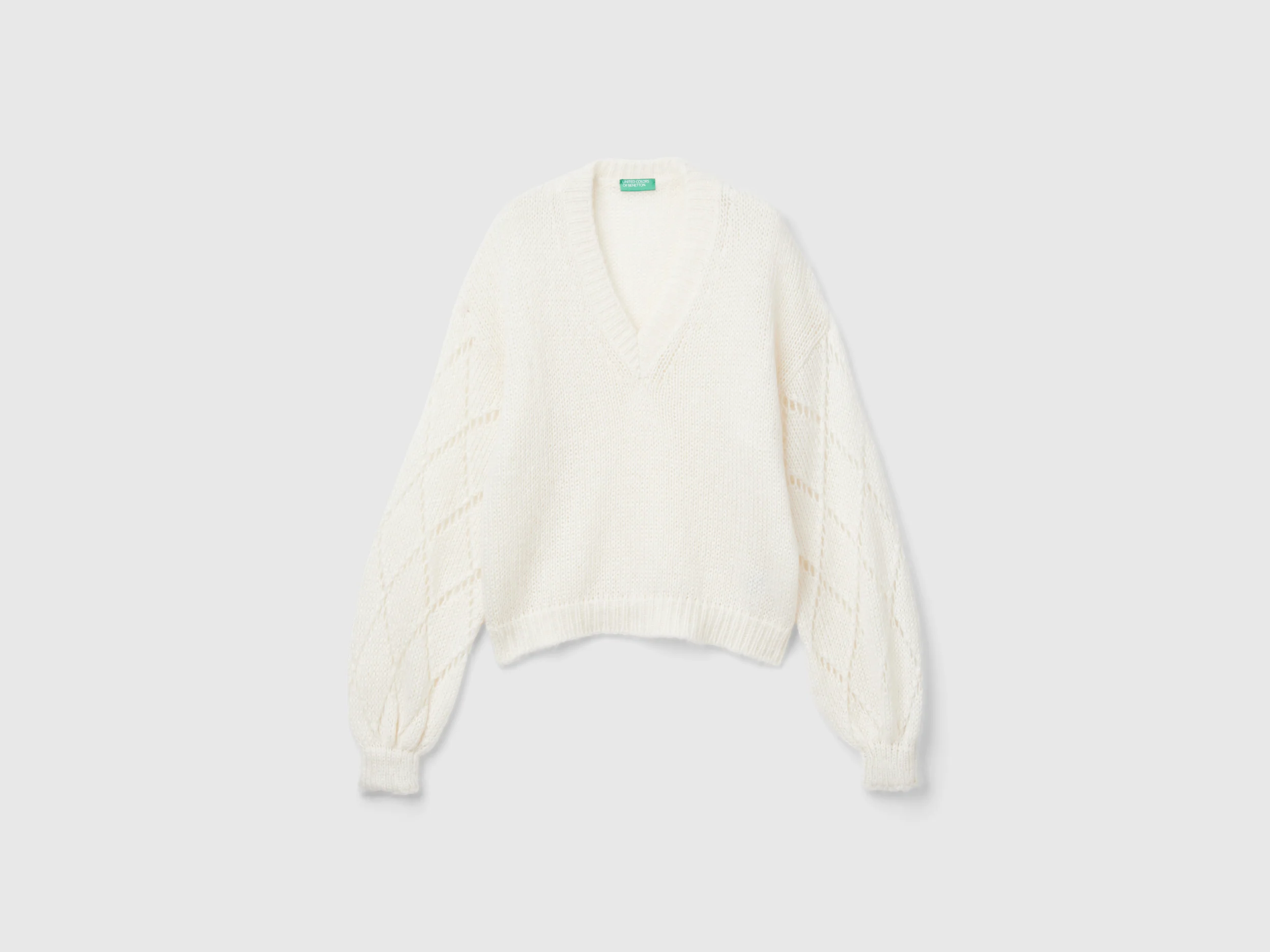 Maglione con manica traforata