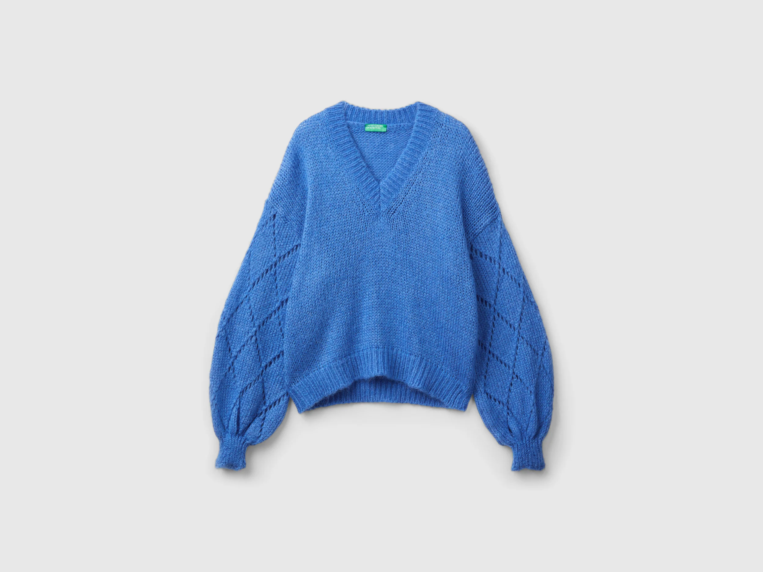 Maglione con manica traforata