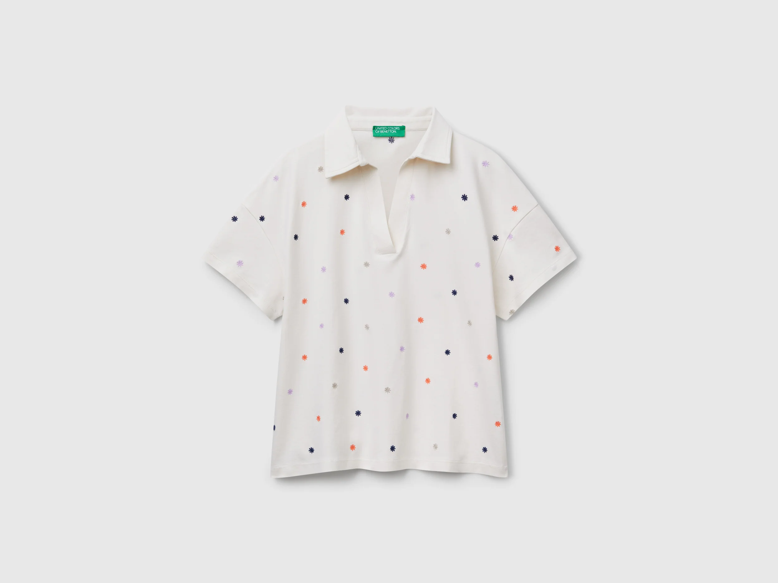 Polo con ricamo fiori