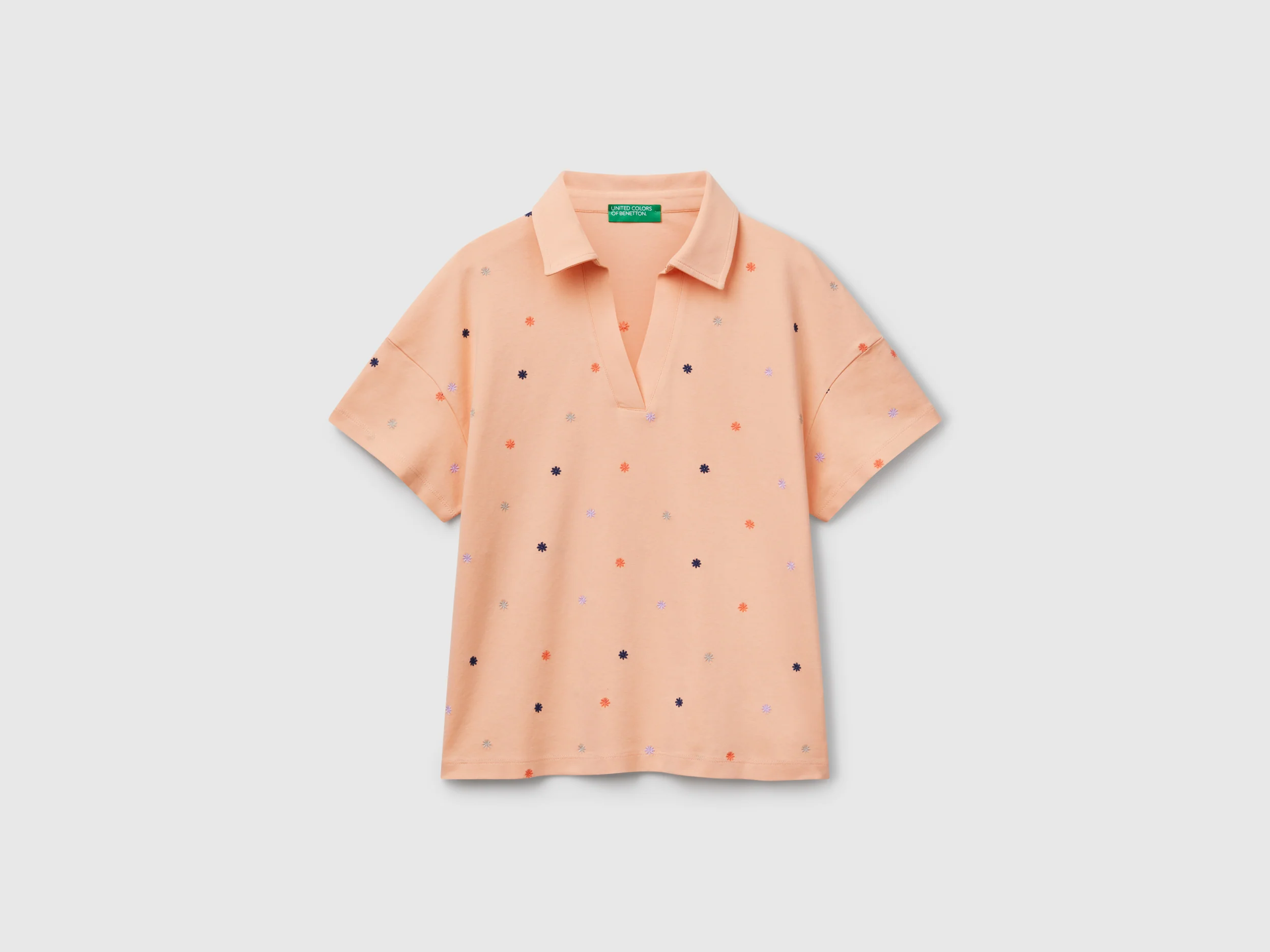 Polo con ricamo fiori